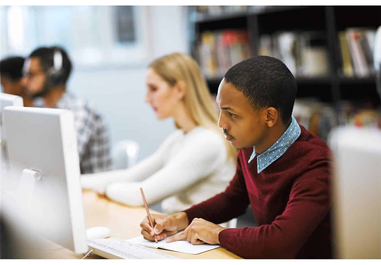 Hero-image-of-teens-studying-looking-at-a-PC
