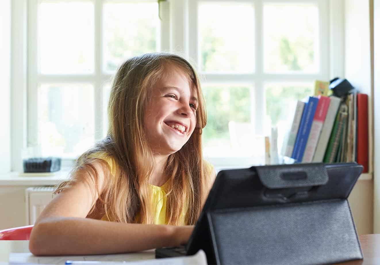 Girl doing blended learning using a tablet