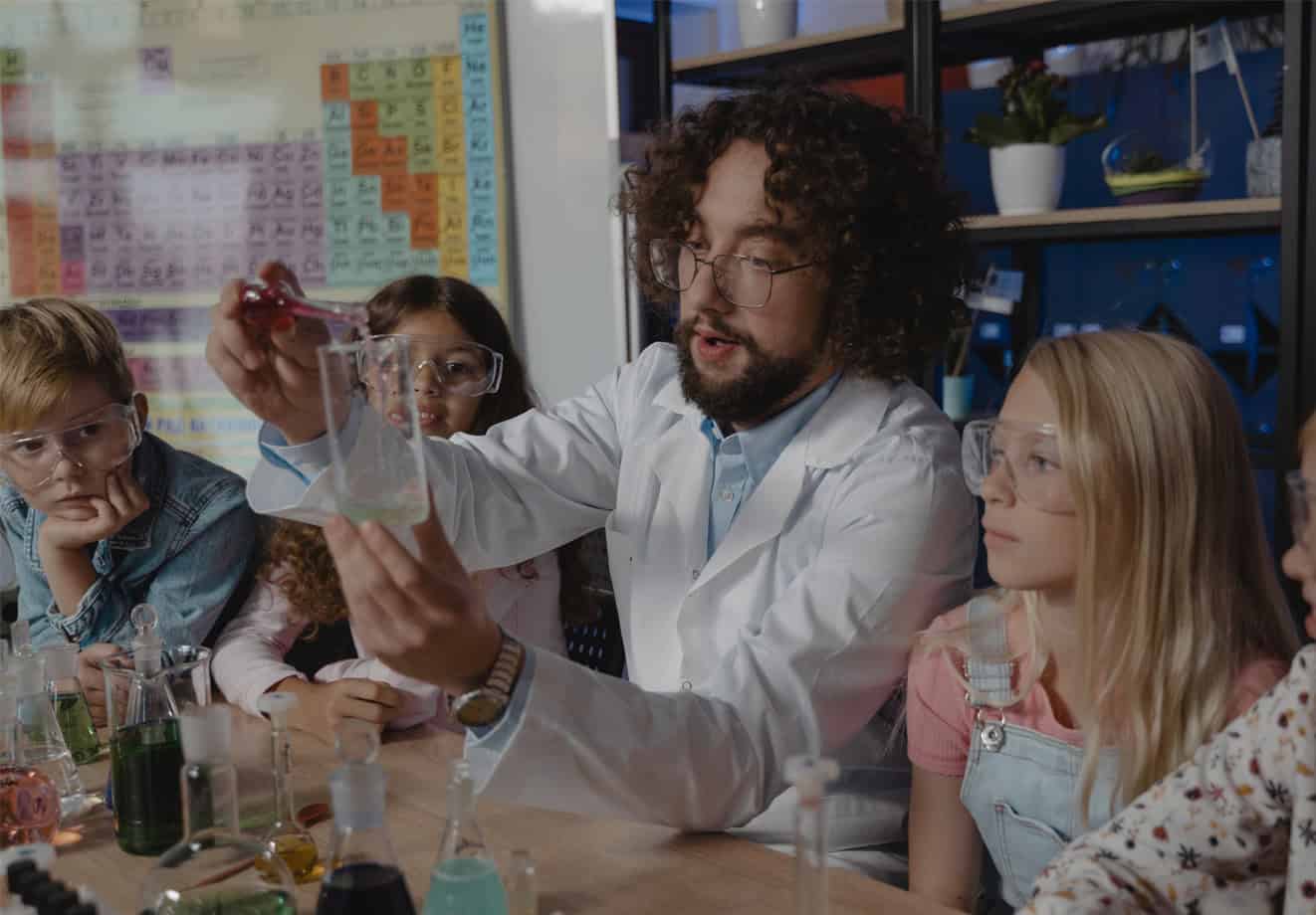 teacher showing students a science experiment