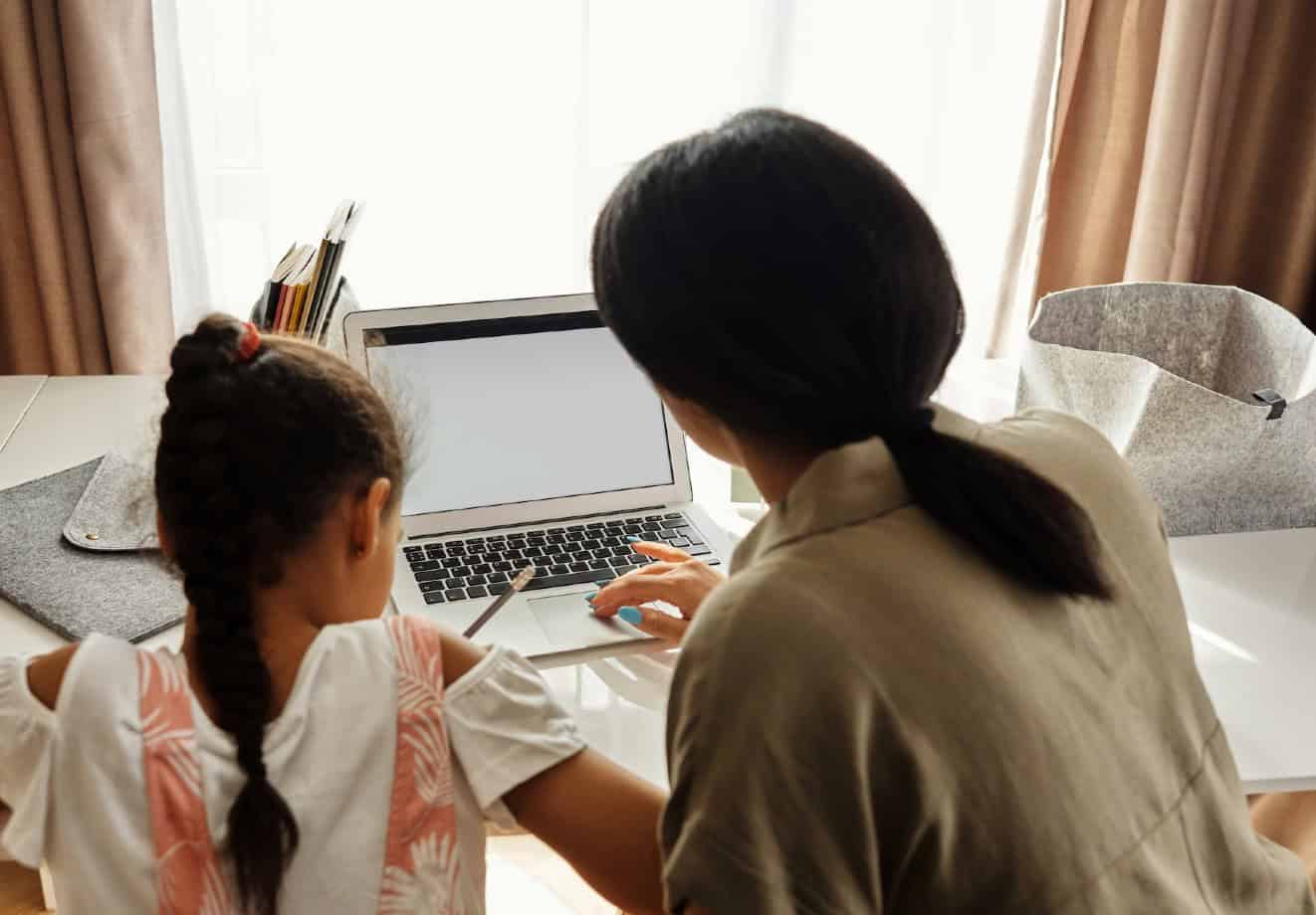 Mother and Daughter doing homework at home