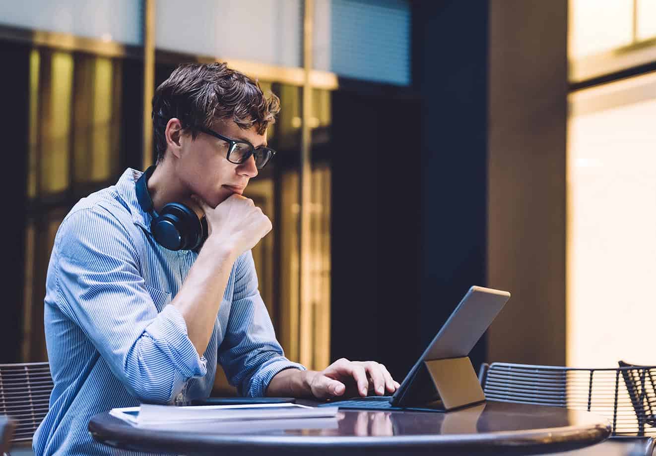 A student studies at a laptop.