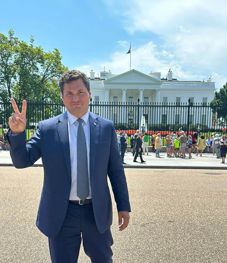 John Baker standing in front of White House