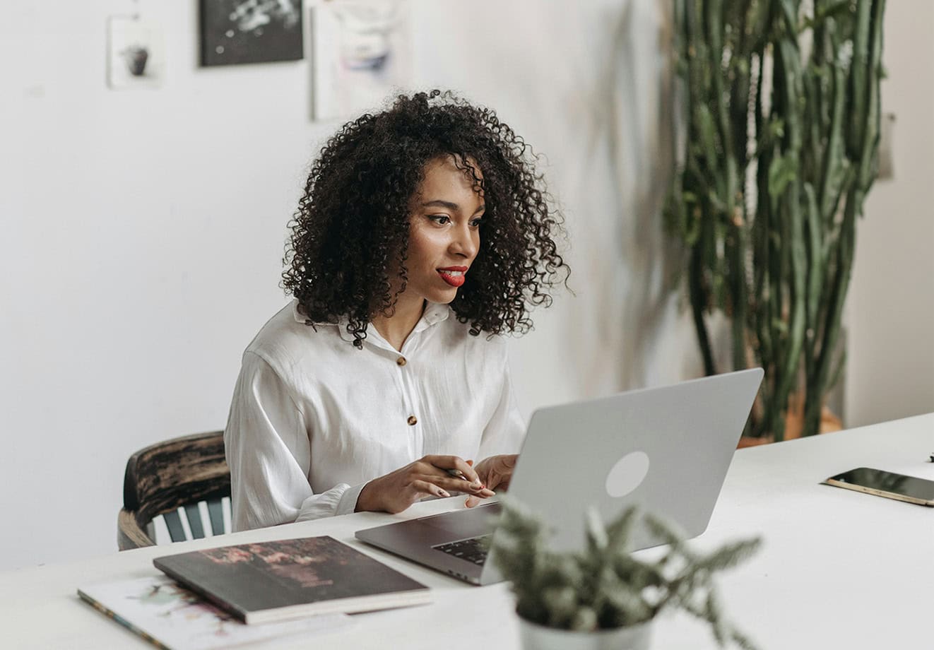 Teacher working on laptop at a desk