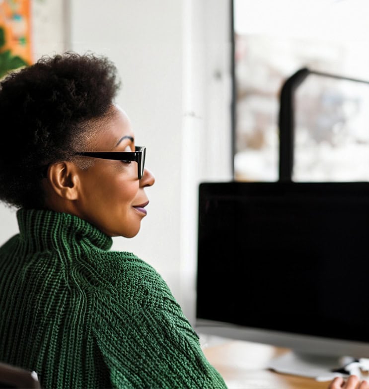 Woman working on computer in office