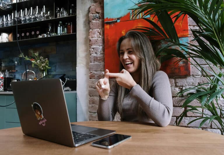 Woman using sign language in virtual meeting