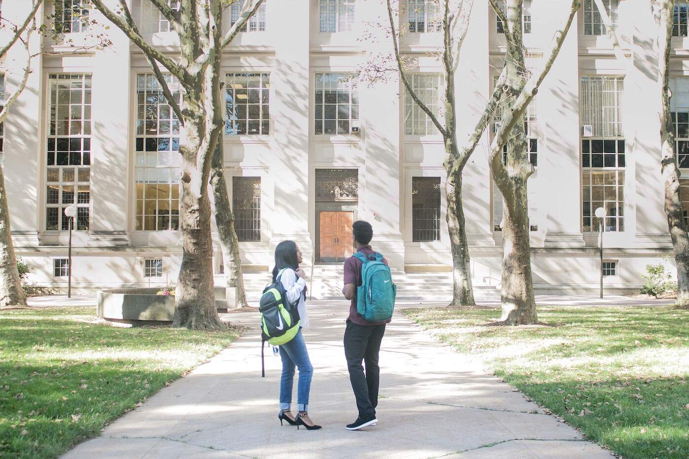 students in front of college