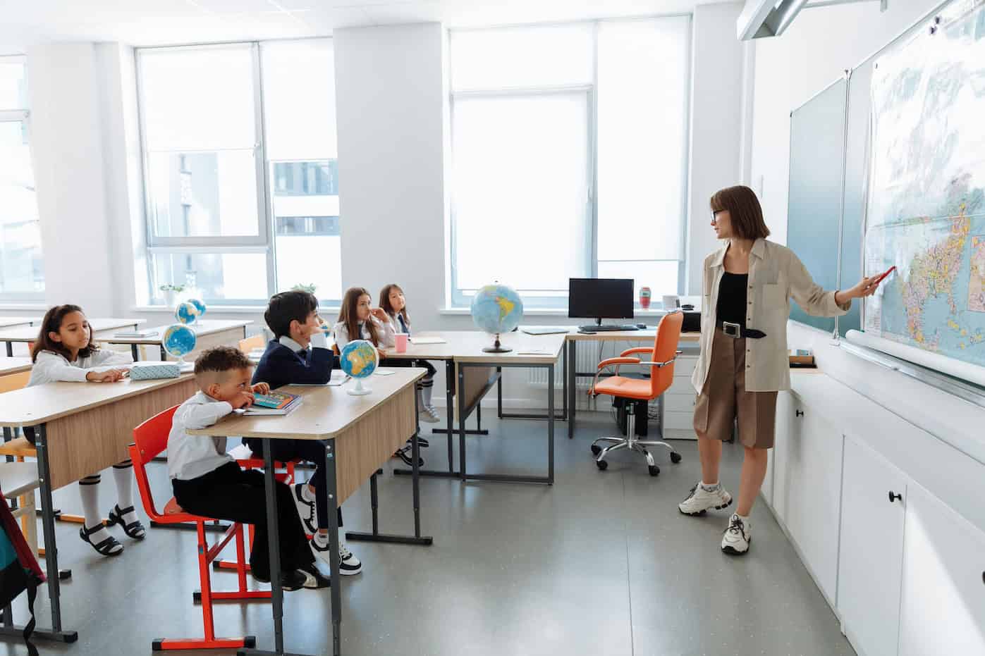 K-12 school teacher with students