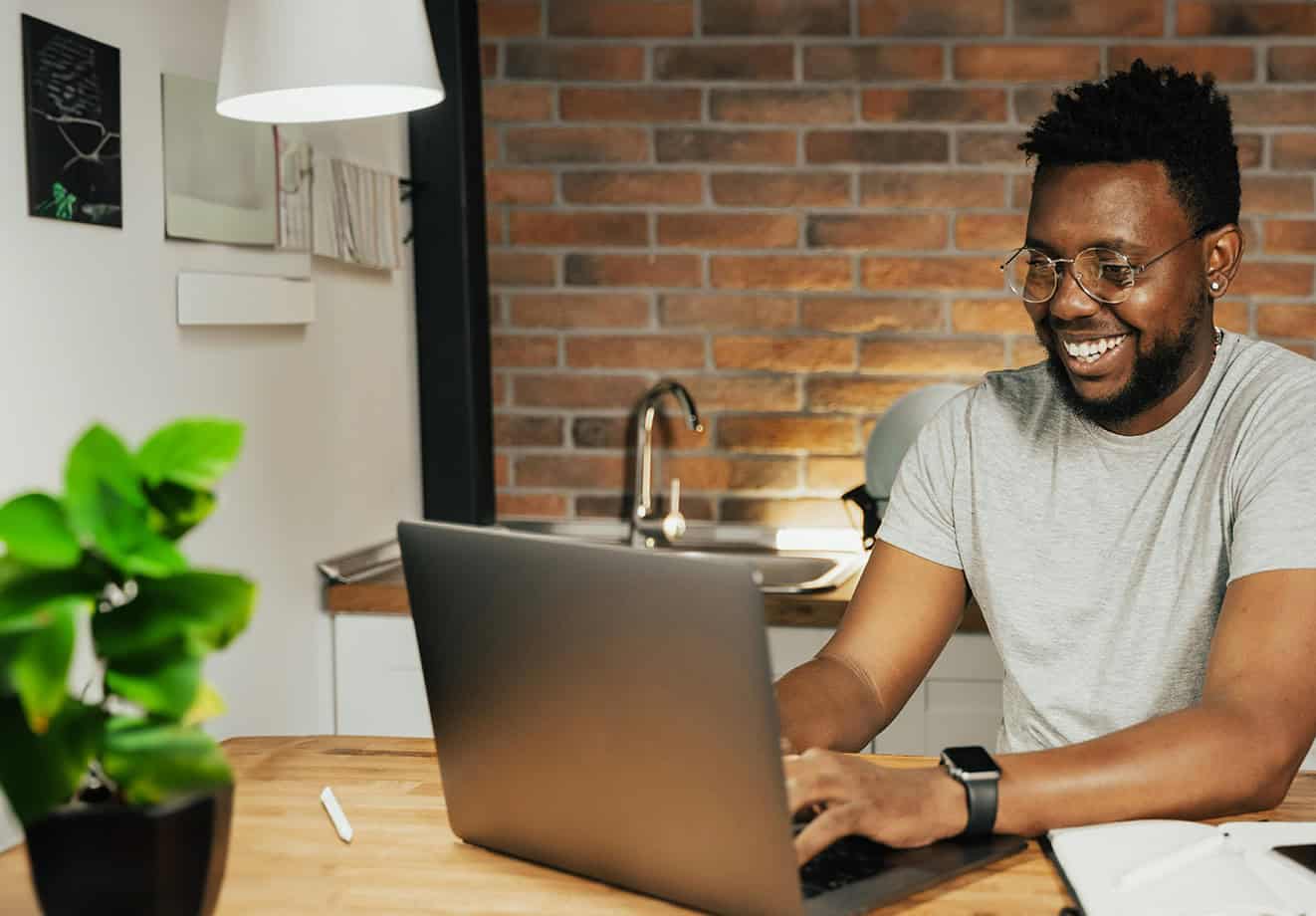 Man working on laptop in home office