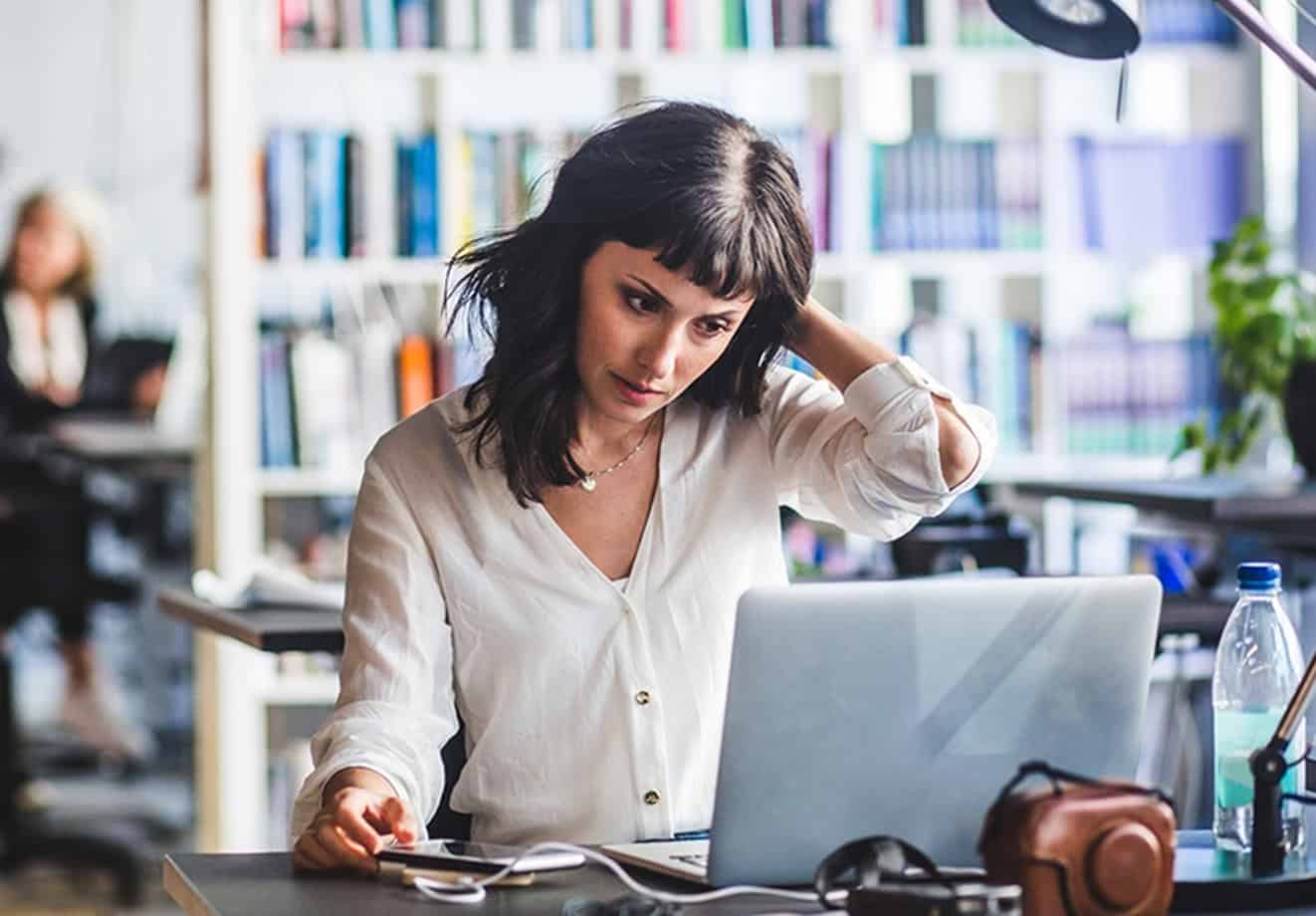 Woman working on computer at desk