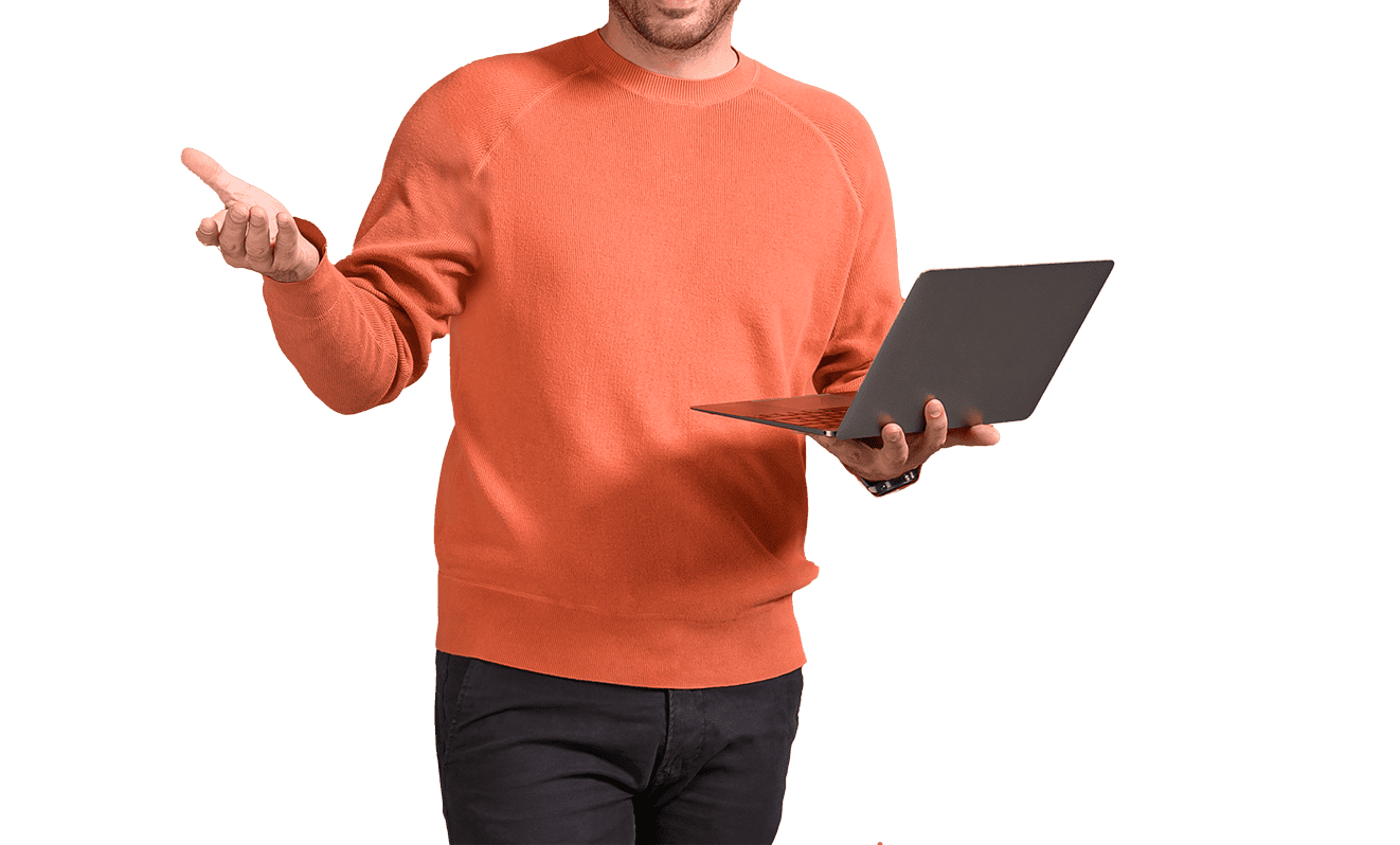 Man in orange sweater holding a laptop