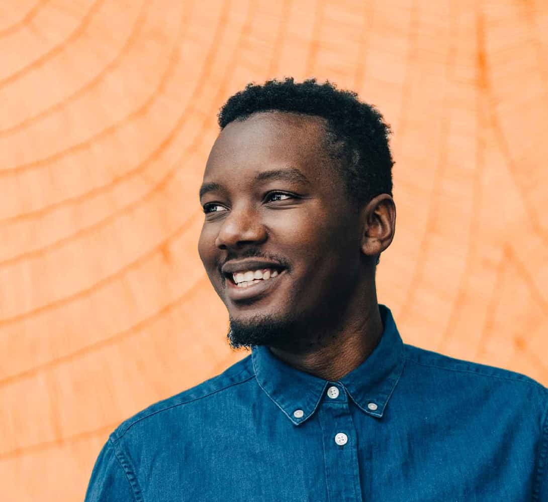 Smiling man wearing blue button shirt