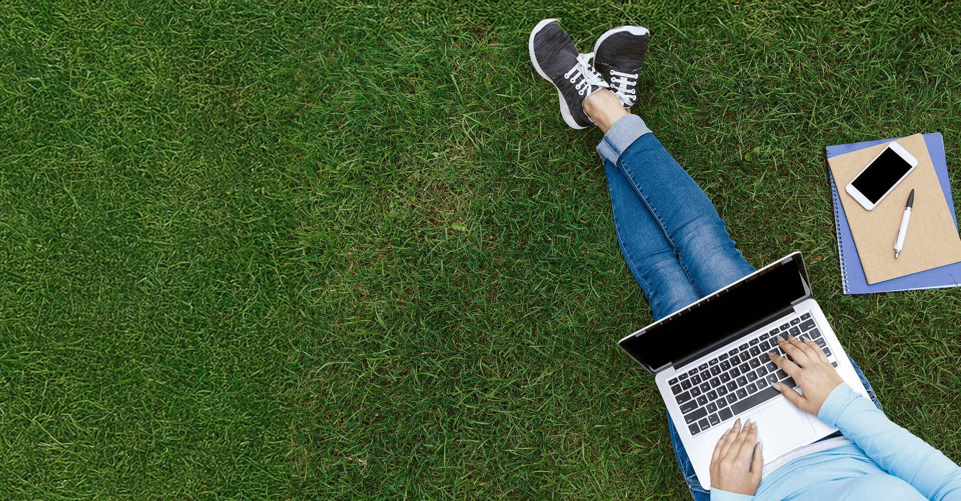 Student sitting on the grass