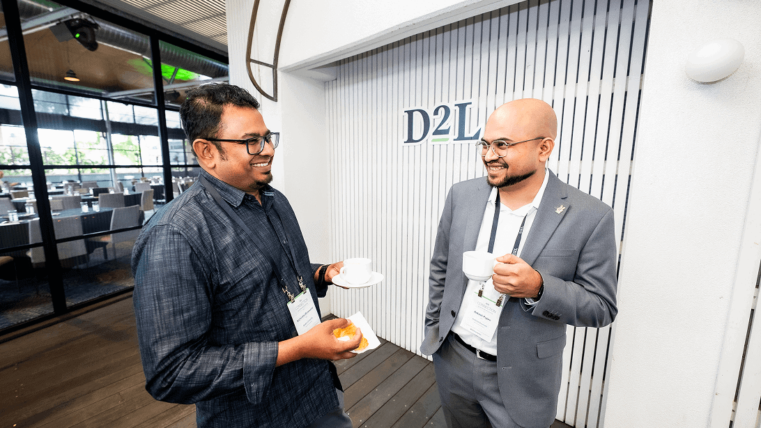 2 person chit chating over cup of coffee