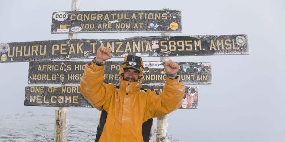 Climber at Uhuru Peak, Mount Kilimanjaro.