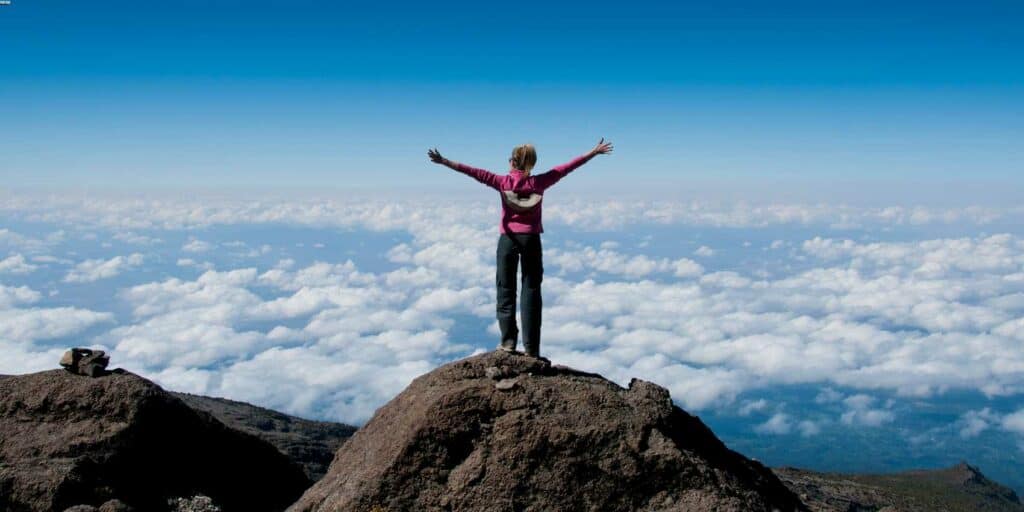 Climber on the summit of Mount Kilimanjaro.