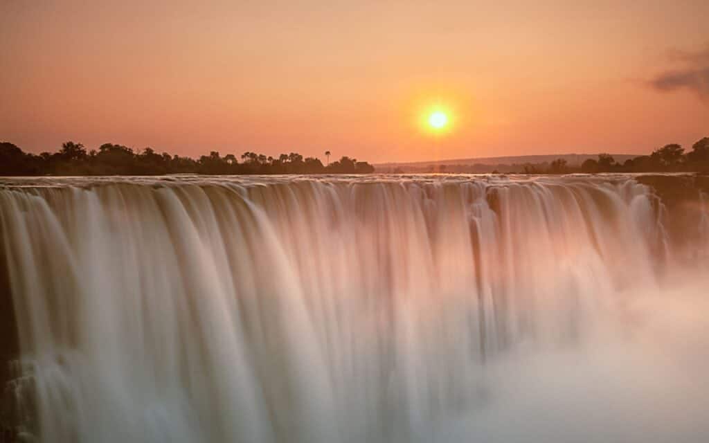 Victoria Falls at Sunset in Zimbabwe | Photo credit: 2630ben via Canva