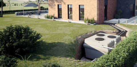 filtre compact placé dans un jardin
