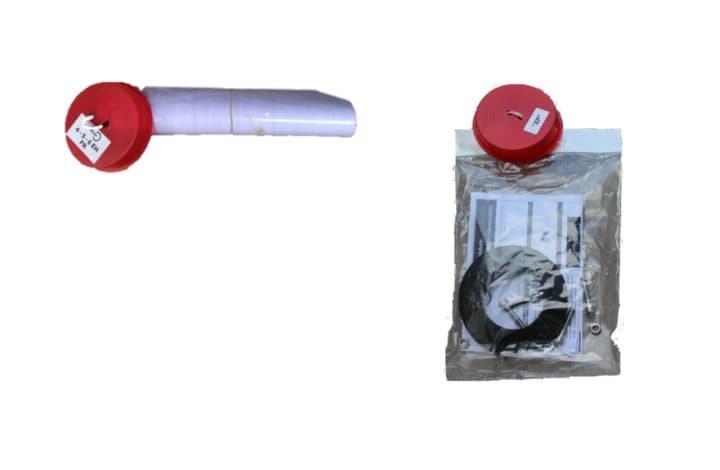 bouchon en plastique de couleur rouge qui referme la sortie OUT de votre filtre compact