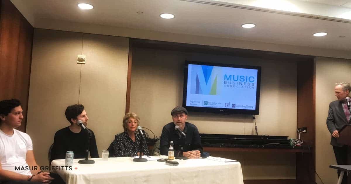panel of people sitting at table
