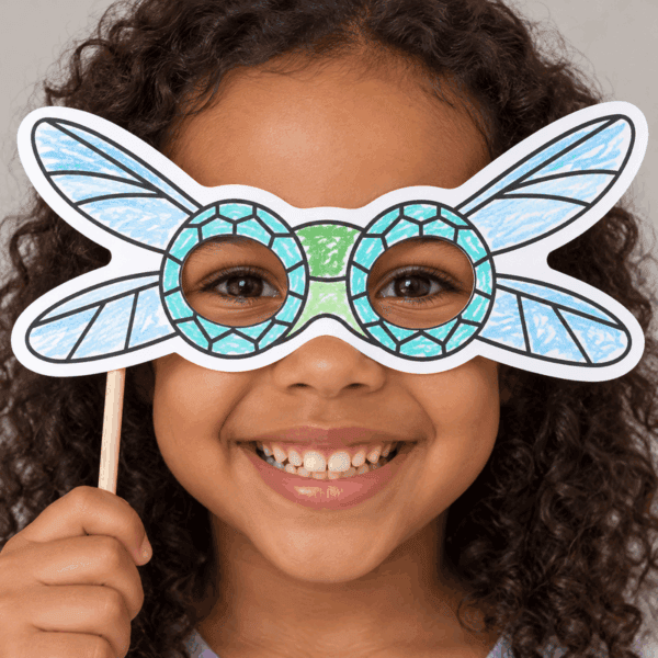 Dragonfly paper mask coloring - child wearing finished mask