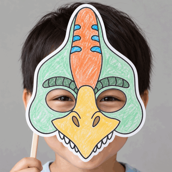 Dinosaur paper mask coloring printable craft - child wearing the finished mask
