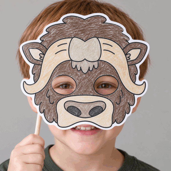 Musk ox paper mask printable coloring craft for kids - child wearing the finished mask