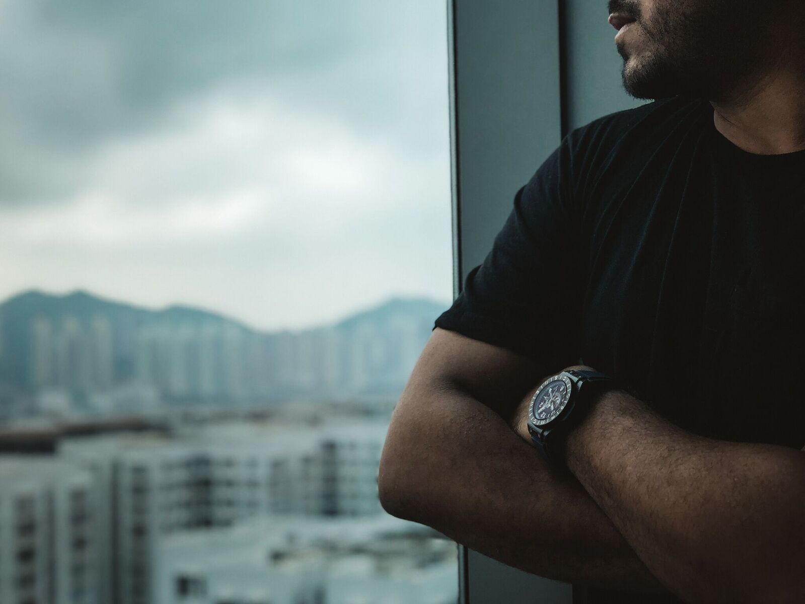 Hublot Big Bang Unico GMT Carbon on the wrist by a window in Hong Kong, the brand Bennahmias is joining as a consultant