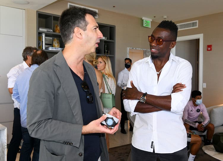 Blaise Matuidi inspects a Ulysse Nardin timepiece with company President Francois Xavier Hotier