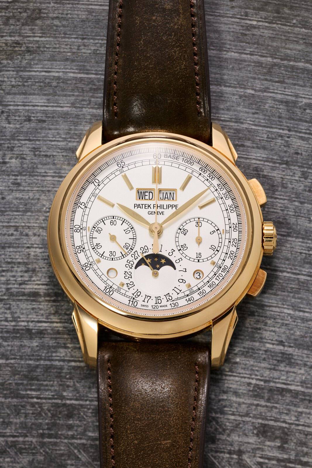 Patek Philippe Ref. 5270J perpetual calendar chronograph in yellow gold with silvery dial on a brown strap