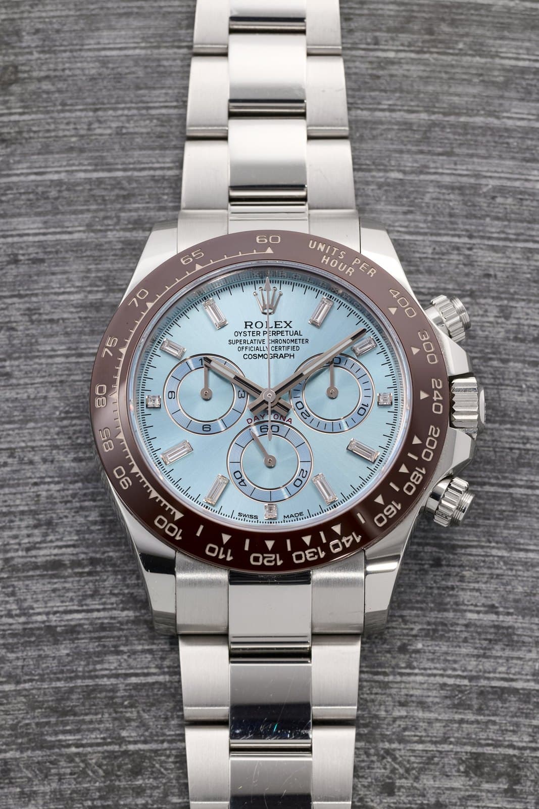 Rolex Cosmograph Daytona Ref. 116506 in platinum with ice blue dial and brown ceramic bezel on an Oyster bracelet