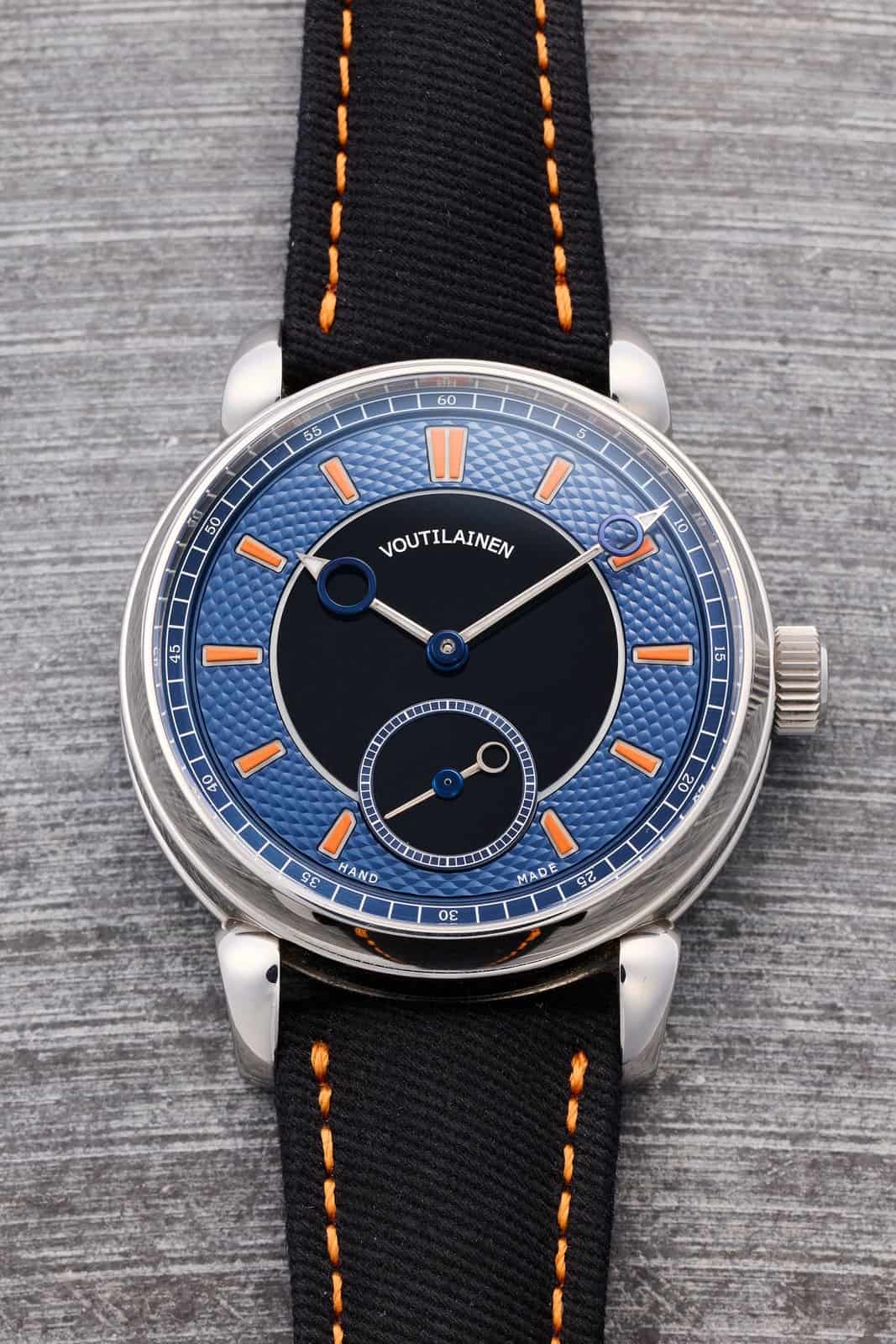 Voutilainen 28Sport in stainless steel with blue guilloché and onyx dial and orange-accented strap