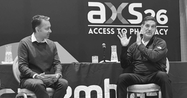 Ankit Jain and Santiago Abraham present on stage at Asembia's AXS26 Summit in this black-and-white photo.