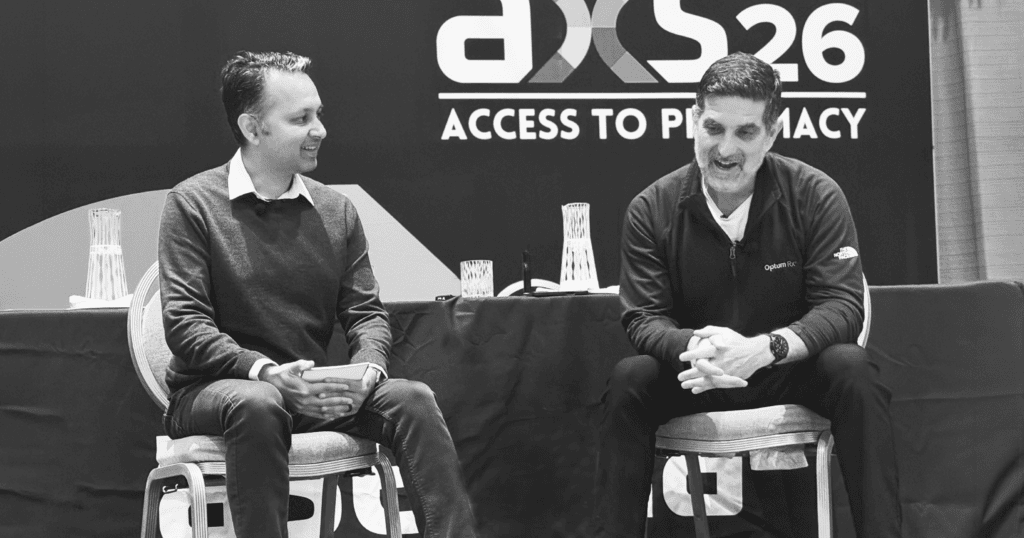 A black-and-white photograph of Ankit Jain and Santiago Abraham on stage at Asembia's AXS26.