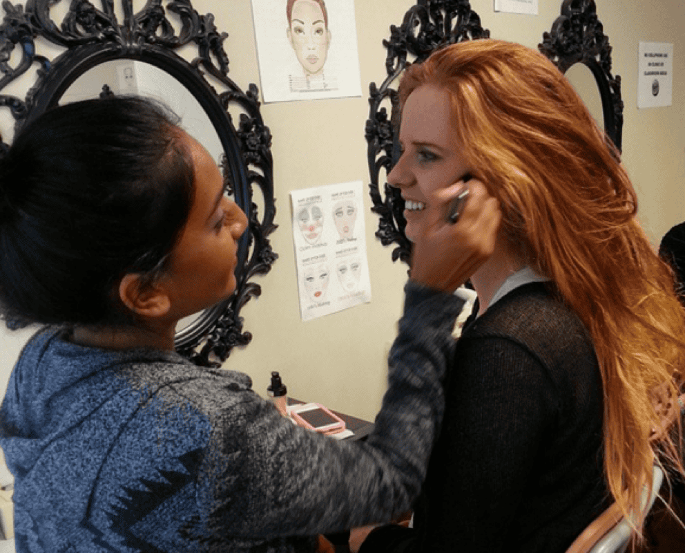 Students take turns in the client’s chair in makeup artistry classes at IBI 