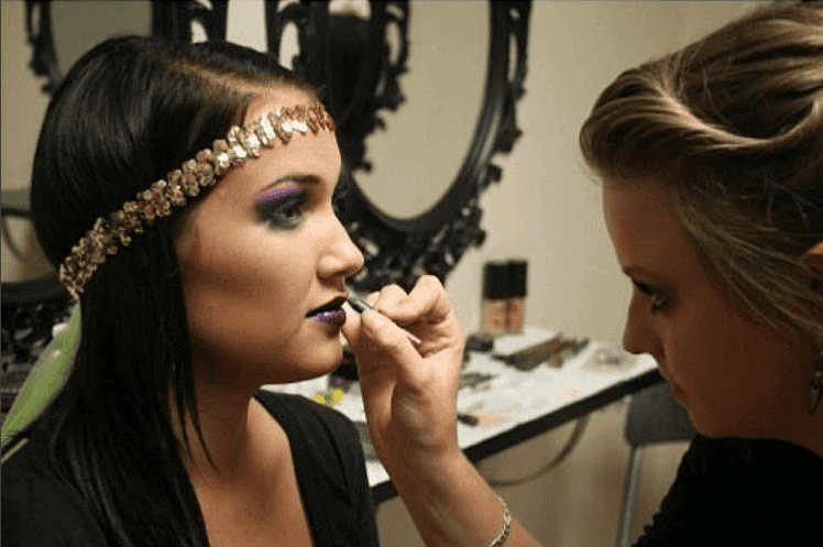 makeup artist school student applies makeup