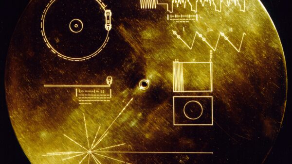 the voyager golden record - a golden disc with various symbols and diagrams etched onto its surface.