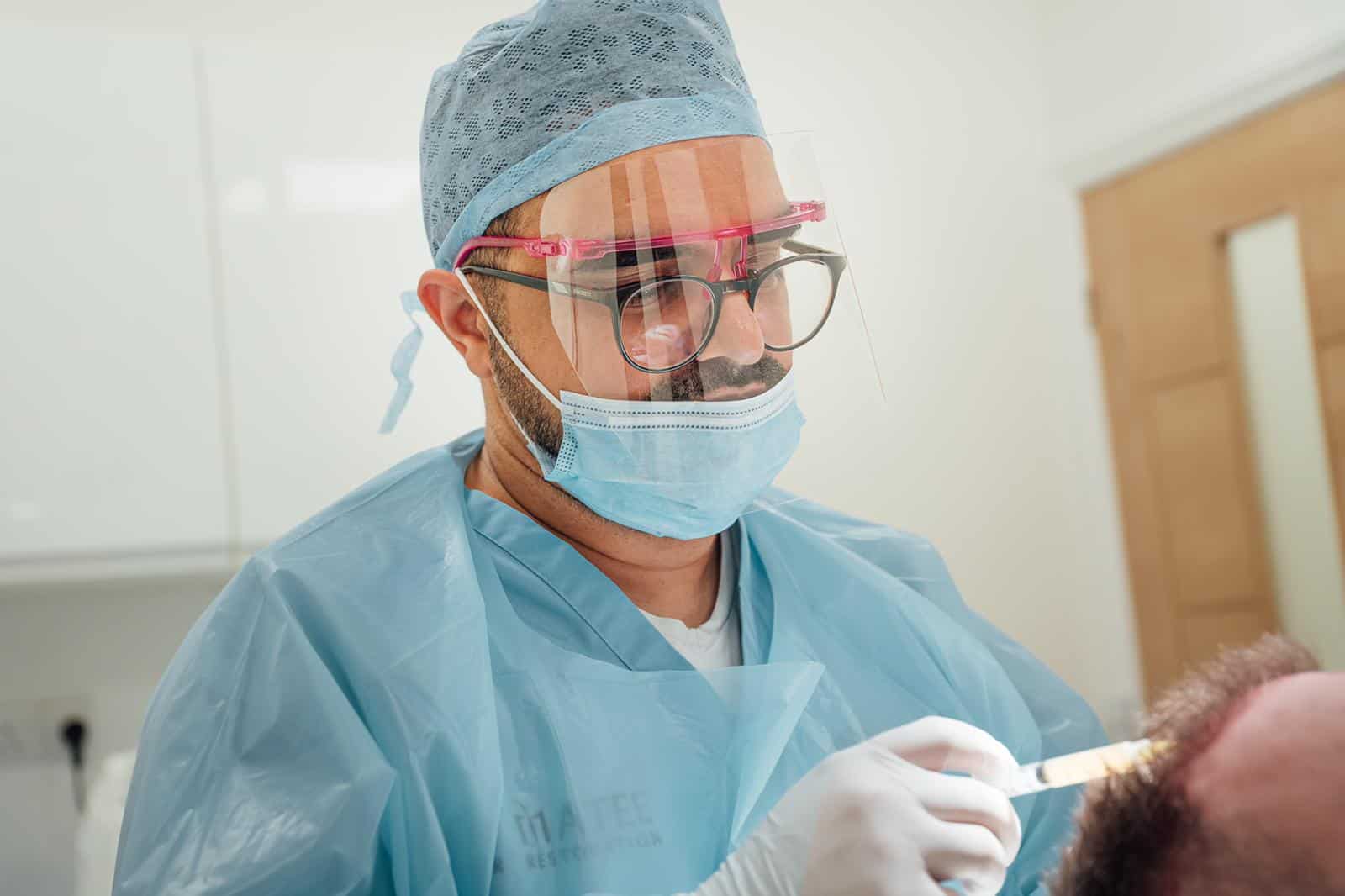 DR Matee performing PRP treatment