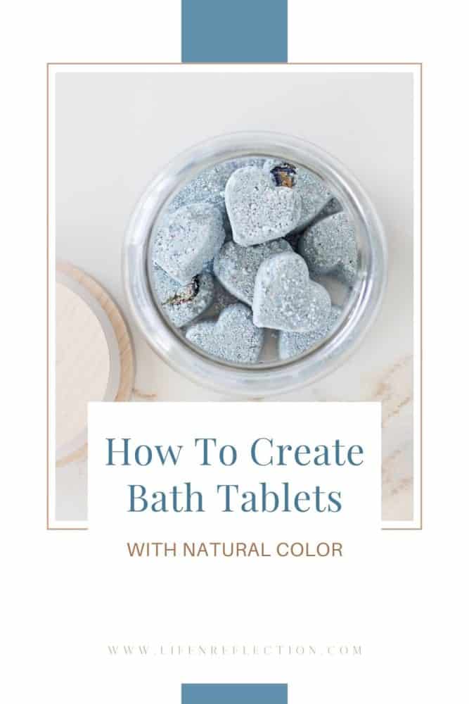 closeup of blue heart shaped bath tablets in an open glass jar