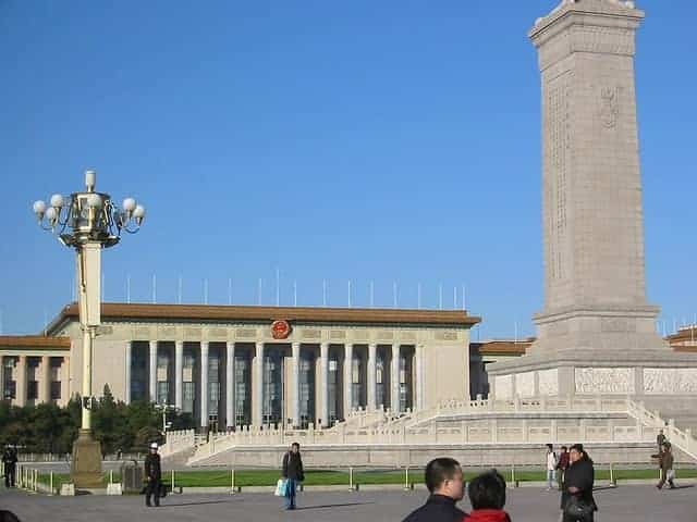Temple of Heaven in Beijing with blue-tiled circular hall and visitors in the surrounding park