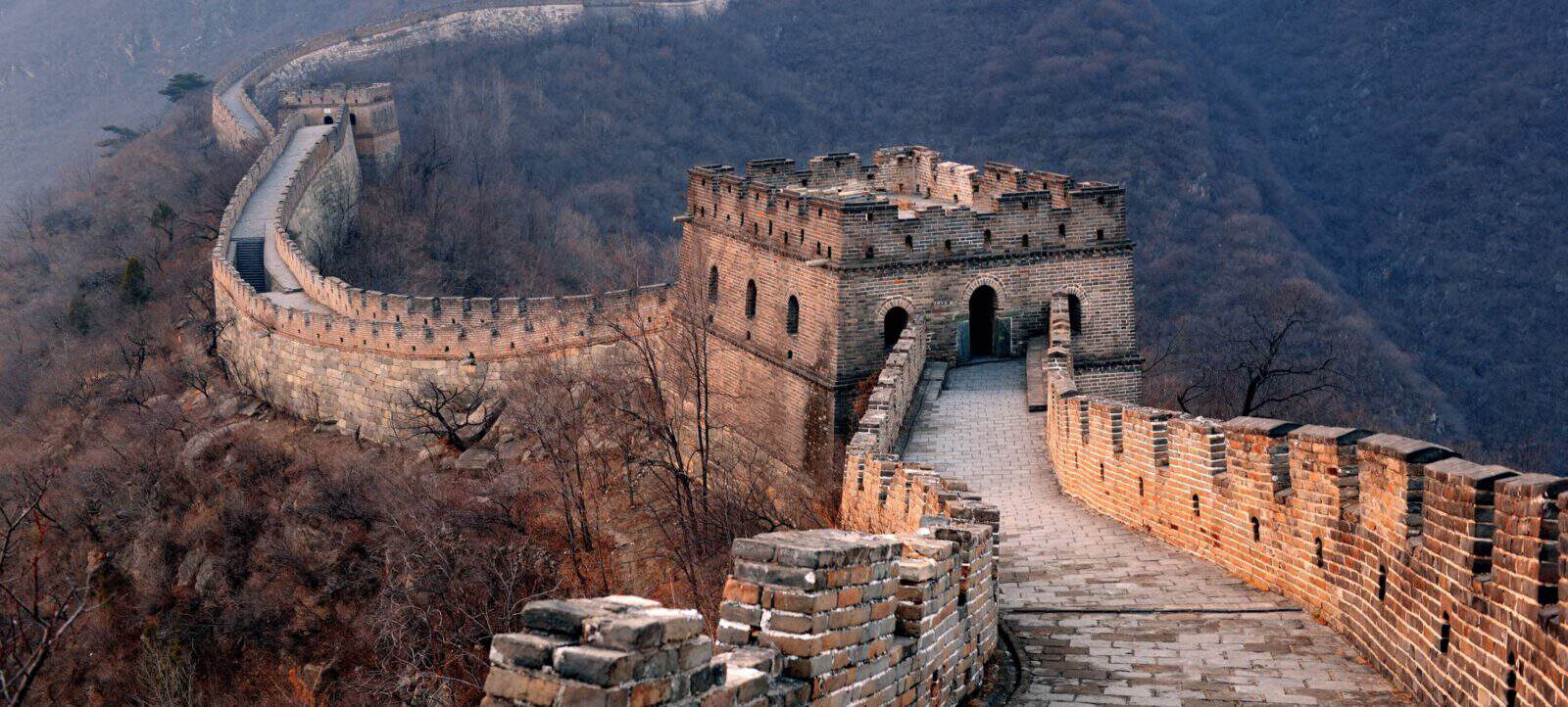 Great Wall of China at Mutianyu winding over green mountain ridges on a clear day
