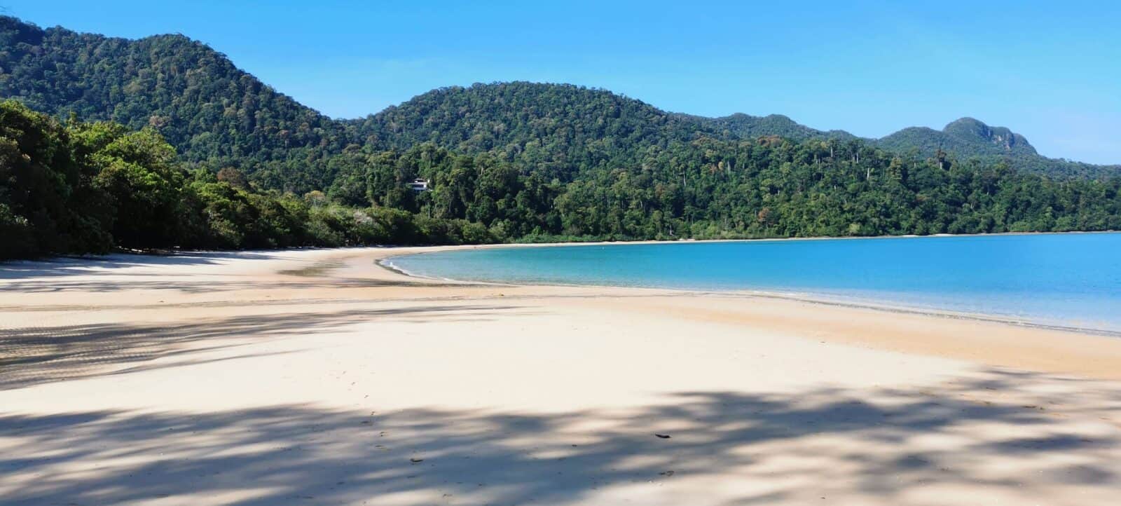 Tropical resort on Langkawi with palm trees, pool and beach overlooking the Andaman Sea