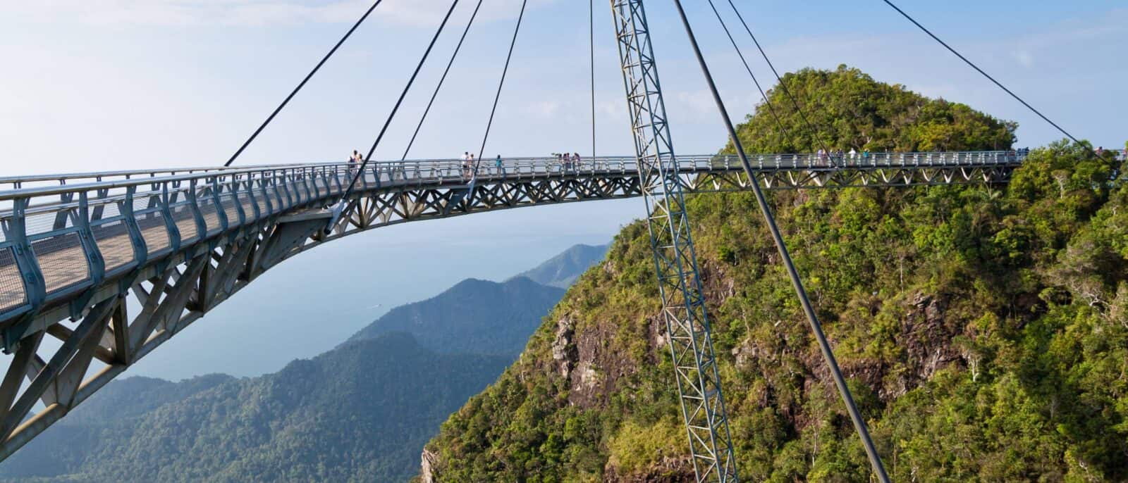 Langkawi Sky Bridge curving above lush green mountains with sea views