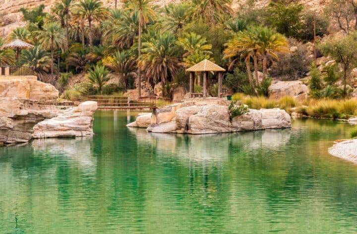 Panoramic view over the rugged cliffs and deep canyon of Jabal Shams in northern Oman under a clear blue sky