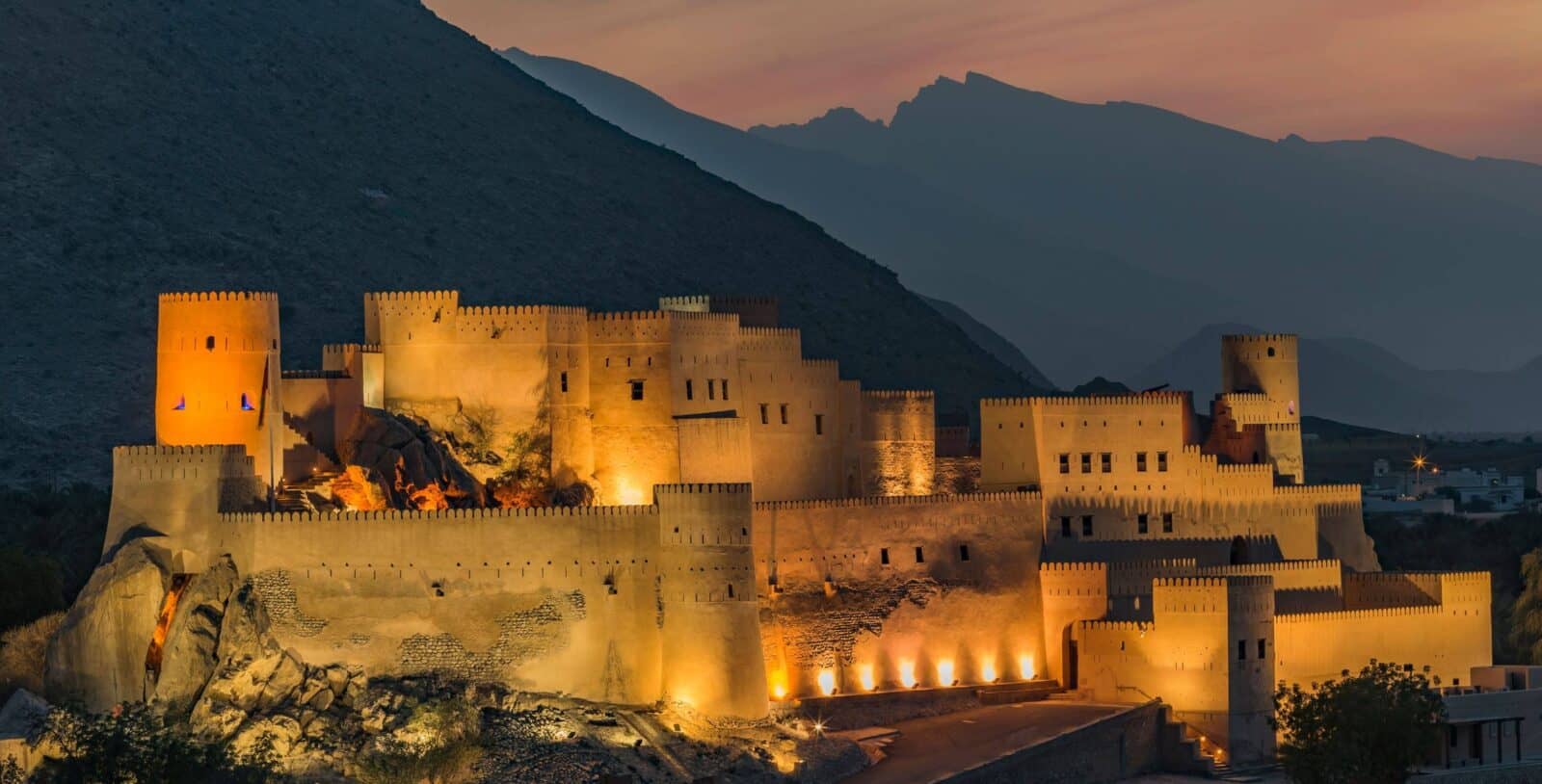 View of Muscat with the Sultan Qaboos Grand Mosque and surrounding white buildings backed by rocky mountains