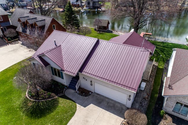 Lakefront property in Fort Wayne upgraded with a premium metal roof by Perfect Steel Solutions, offering a blend of luxury and protection.
