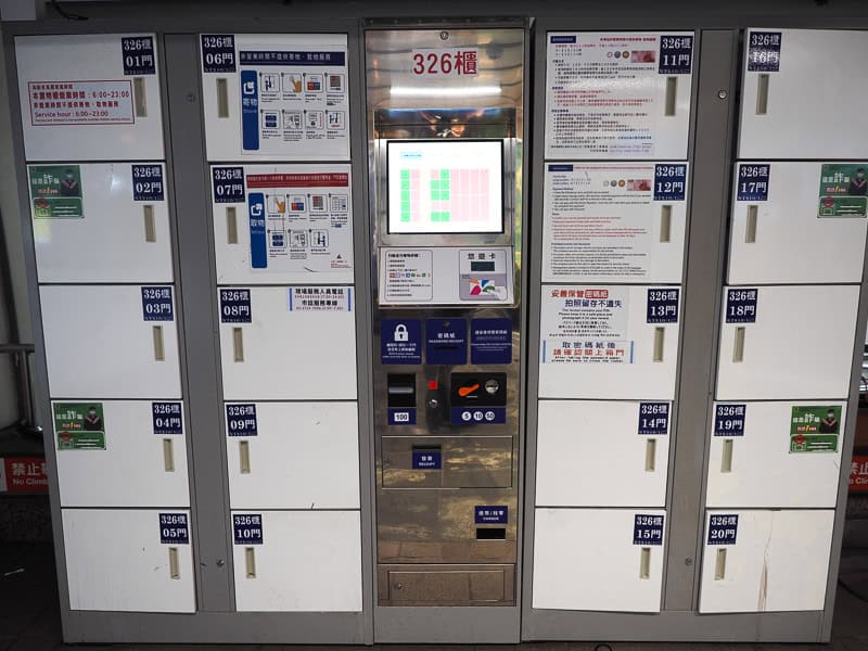 Some white luggage lockers in a train station