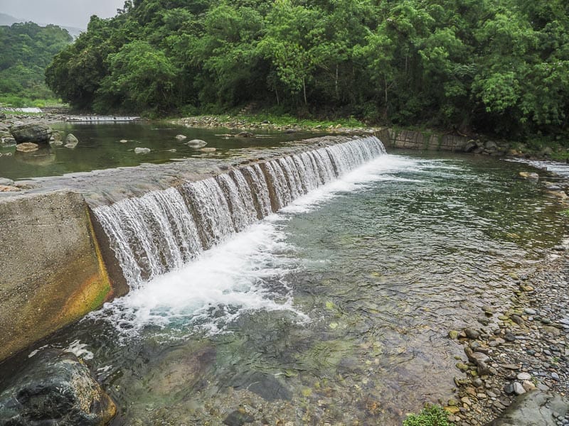 A manmade waterfall on a small river