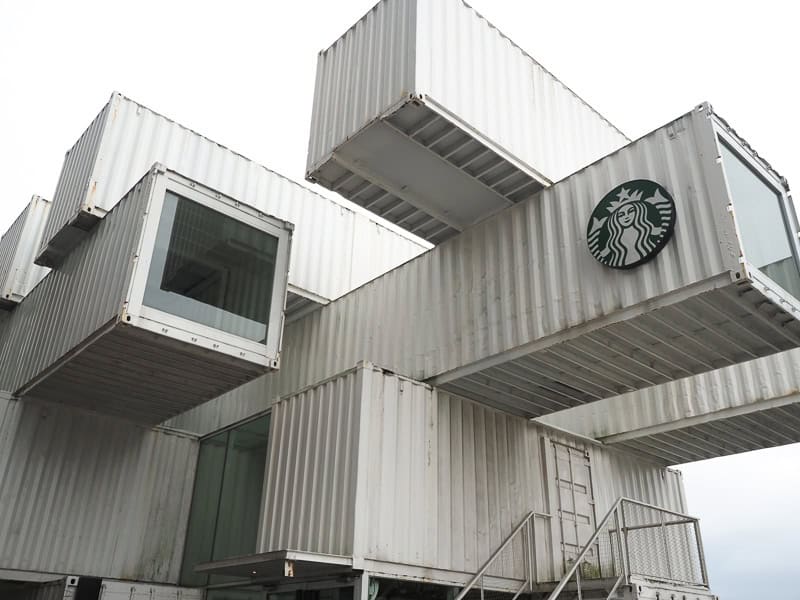 A Starbucks made out of stacked white shipping containers