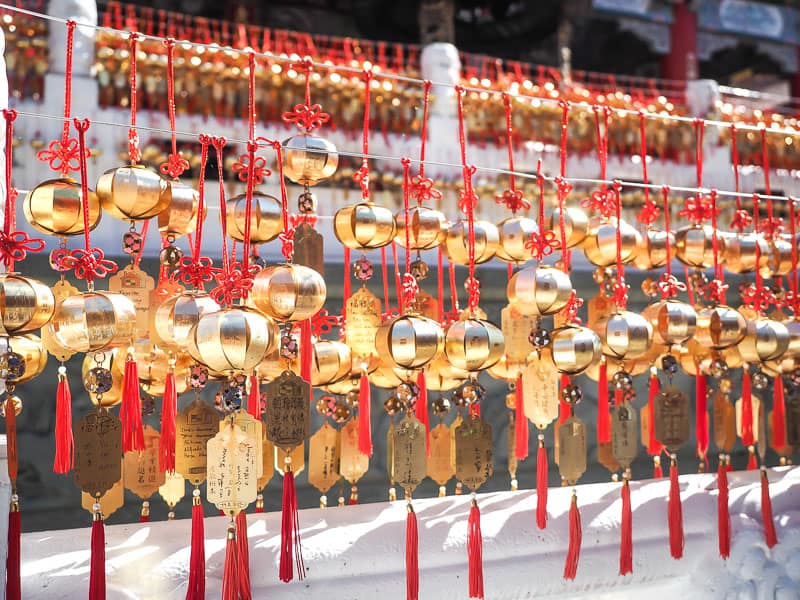 Some rows of hanging golden and red decorations in front of Wenwu Temple at Sun Moon Lake