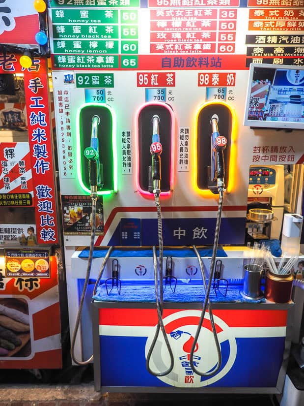 A fake CPC gas pump with three nozzles that dispense iced tea in a night market in Taiwan